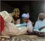 Dilbar Sain and pir mitha Sani discusing.